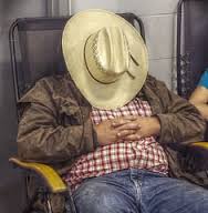 cowboy asleep in chair